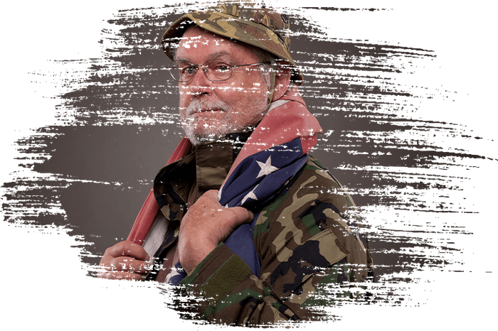 Vietnam veteran with American flag draped on his shoulders